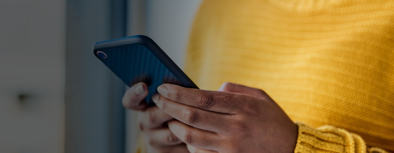 Image of woman holding a smart phone