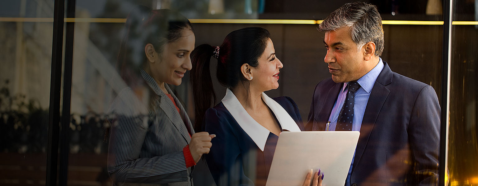 Business people working together with laptop at office